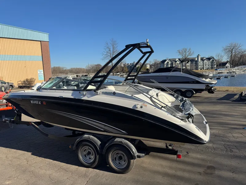 Slide: The Image of 2014 Yamaha SX210 boat on trailer at marina. - 23