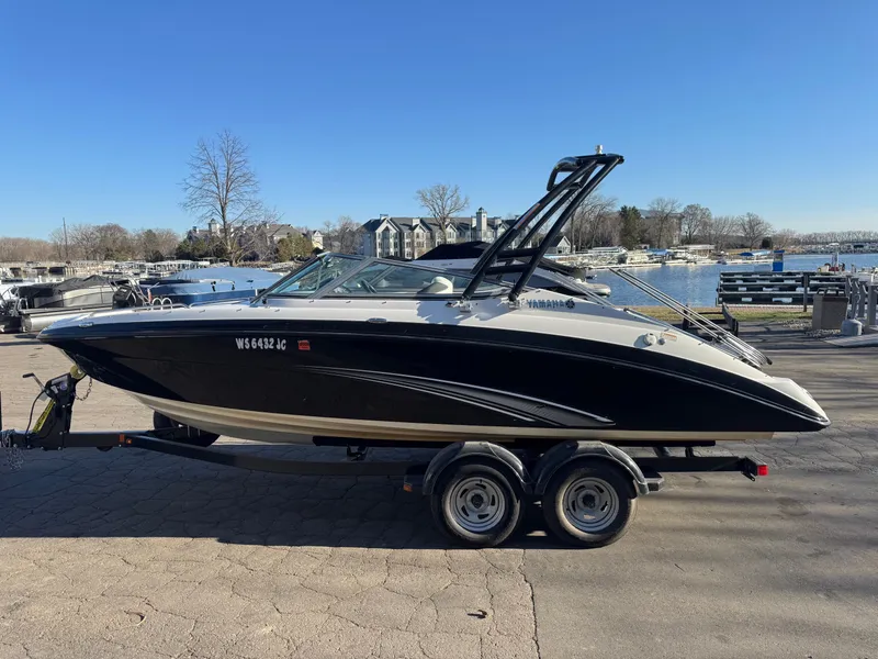 Slide: The Image of 2014 Yamaha SX210 boat on trailer at marina. - 24