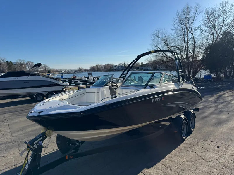 Slide: The Image of 2014 Yamaha SX210 boat on trailer by lakeside. - 25