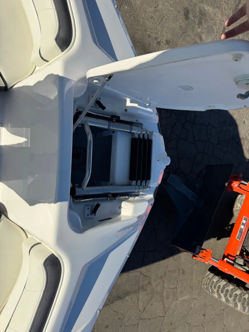 Slide: The Image of Yamaha SX210 2014 boat with open storage compartment lid. - 27