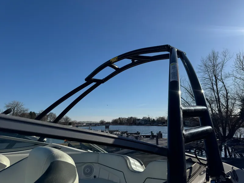 Slide: The Image of 2014 Yamaha SX210 boat by the riverside under clear sky. - 28