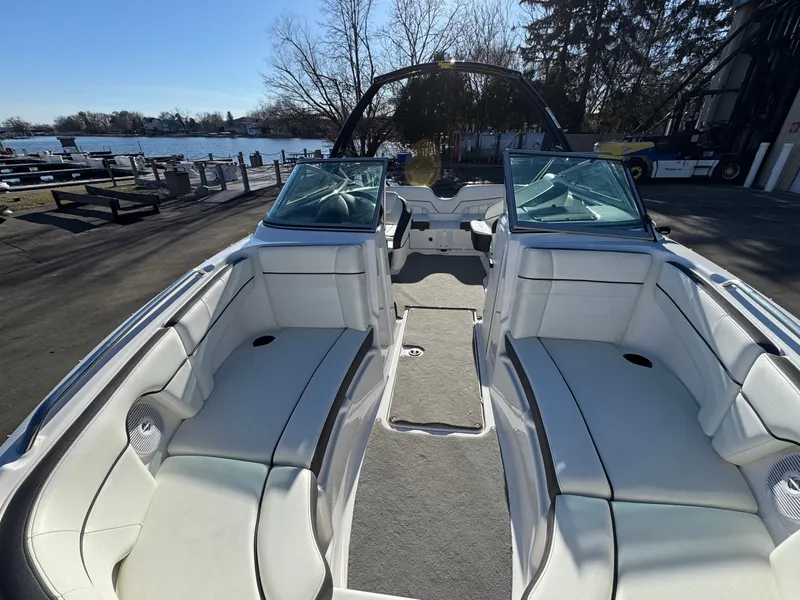 Slide: The Image of Interior view of a 2014 Yamaha SX210 boat at the dock. - 5