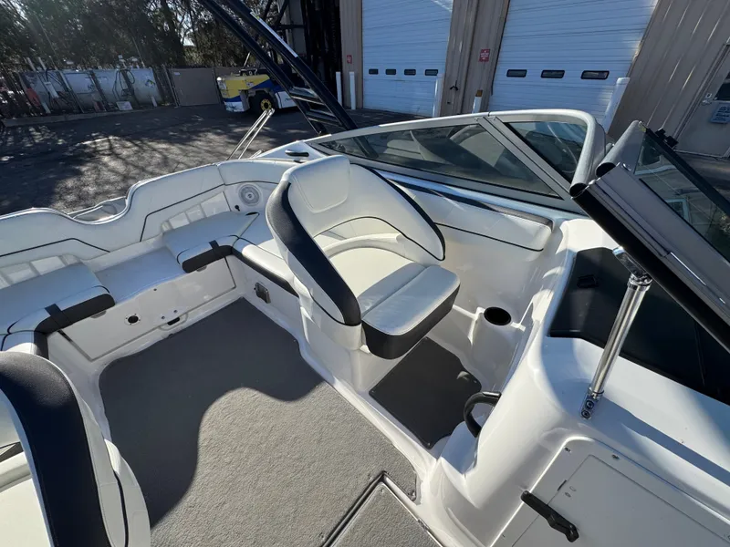 Slide: The Image of Interior of a 2014 Yamaha SX210 boat with white seating. - 8