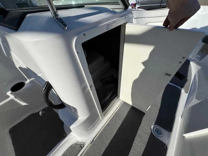 Slide: The Image of Open storage compartment in 2014 Yamaha SX210 boat. - 9