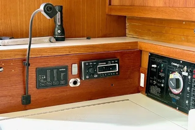Slide: The Image of Control panel of a 1992 Catalina 34 sailboat with radio and flashlight. - 15