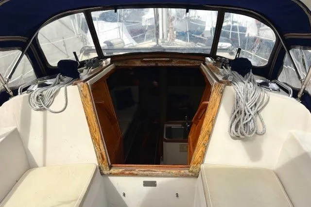 Slide: The Image of Cockpit view of a 1992 Catalina 34 sailboat with ropes and seating. - 2
