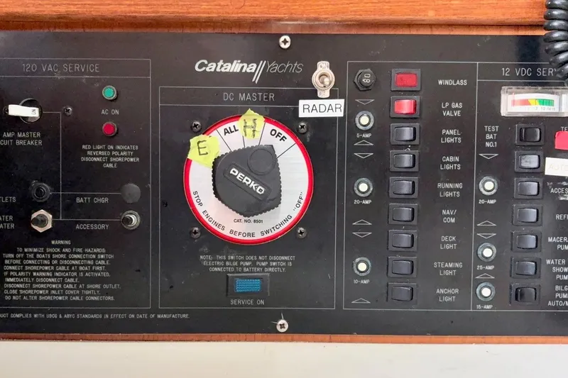 Slide: The Image of Control panel of a 1992 Catalina 34 yacht with various switches and indicators. - 24