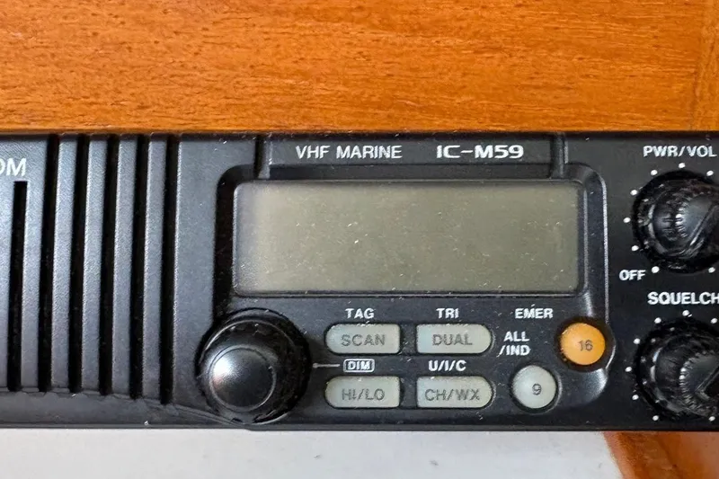 Slide: The Image of VHF marine radio IC-M59 on 1992 Catalina 34 sailboat, featuring control knobs and display. - 25