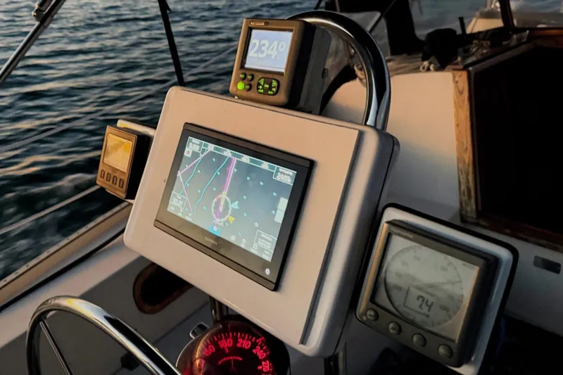 Slide: The Image of Cockpit navigation instruments on a 1992 Catalina 34 sailboat at sea. - 6