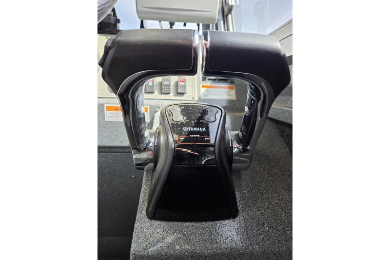 Slide: The Image of Throttle controls on a 2012 Duckworth 28 Offshore boat dashboard. - 10