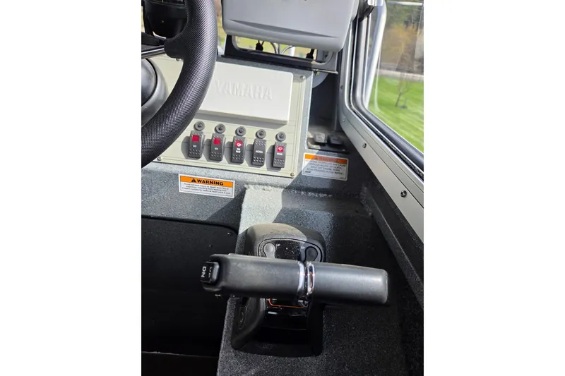 Slide: The Image of Control panel of a 2012 Duckworth 28 Offshore boat with Yamaha switches. - 11
