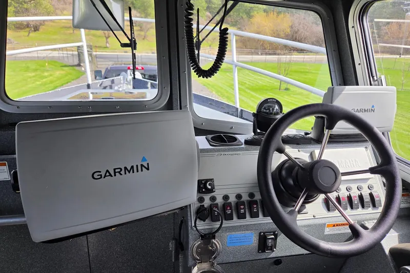 Slide: The Image of Interior of a 2012 Duckworth 28 Offshore boat with Garmin navigation equipment. - 12