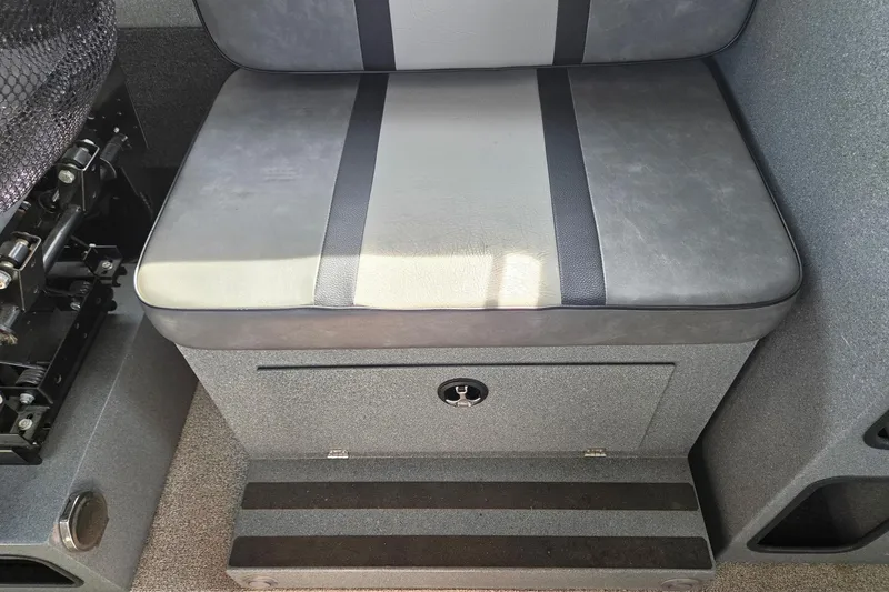 Slide: The Image of 2012 Duckworth 28 Offshore boat seat with storage compartment, featuring gray upholstery and black accents. - 17