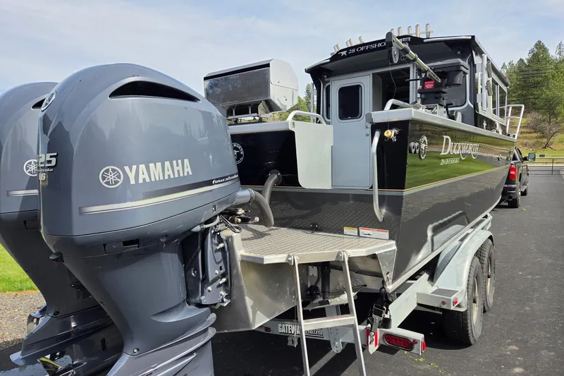 Slide: The Image of 2012 Duckworth 28 Offshore boat with Yamaha engines on a trailer. - 24