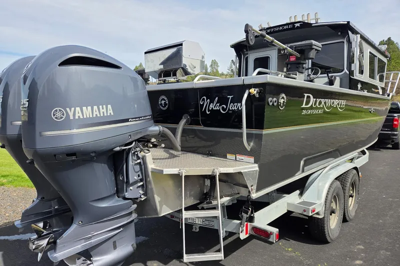 Slide: The Image of 2012 Duckworth 28 Offshore boat with Yamaha engines on a trailer. - 25