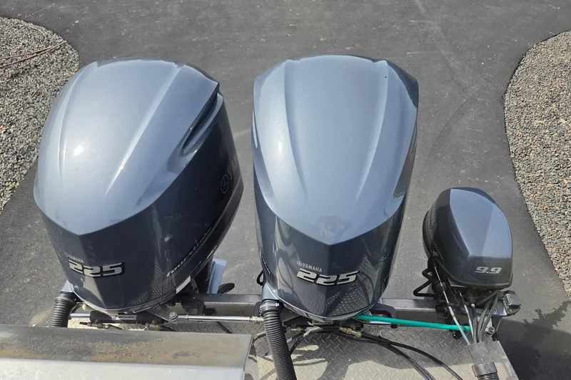 Slide: The Image of Twin Yamaha 225 outboard motors and a 9.9 auxiliary motor on a 2012 Duckworth 28 Offshore. - 26