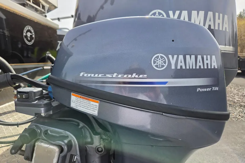 Slide: The Image of Yamaha four-stroke outboard motor on a 2012 Duckworth 28 Offshore boat. - 28