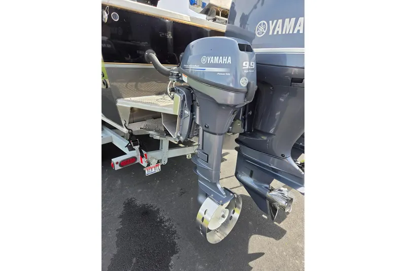 Slide: The Image of Yamaha outboard motor on 2012 Duckworth 28 Offshore boat, parked on trailer. - 29