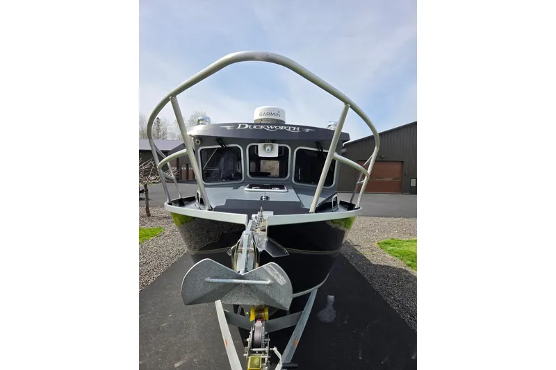 Slide: The Image of 2012 Duckworth 28 Offshore boat with anchor, parked on driveway. - 31