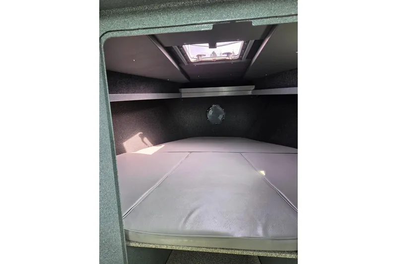 Slide: The Image of Interior cabin of 2012 Duckworth 28 Offshore boat, featuring cushioned sleeping area. - 8