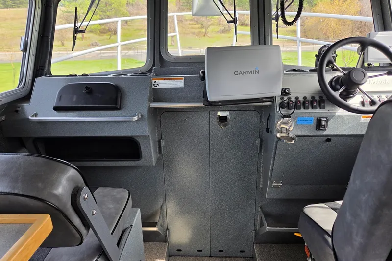 Slide: The Image of Interior of a 2012 Duckworth 28 Offshore boat with Garmin navigation system. - 9