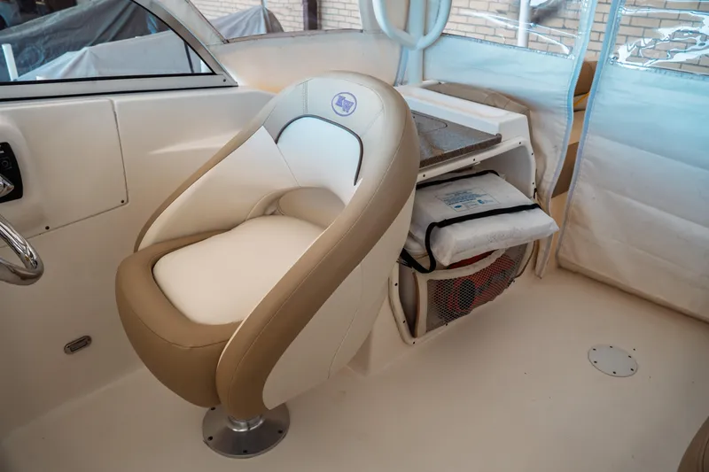 Slide: The Image of 2019 Key West 239 DFS boat interior with beige and white seating. - 21