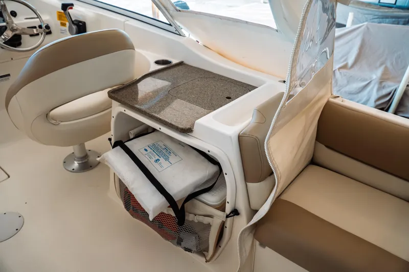 Slide: The Image of 2019 Key West 239 DFS boat interior with seating and storage area. - 24