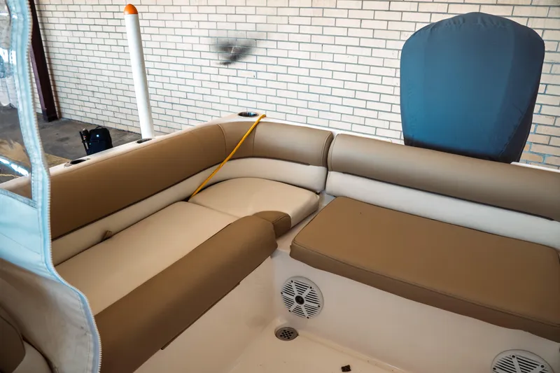 Slide: The Image of Interior seating of 2019 Key West 239 DFS boat with tan upholstery. - 30