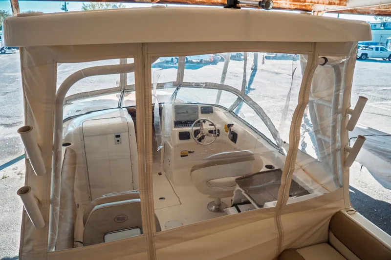 Slide: The Image of 2019 Key West 239 DFS boat interior with protective enclosure and steering console. - 32