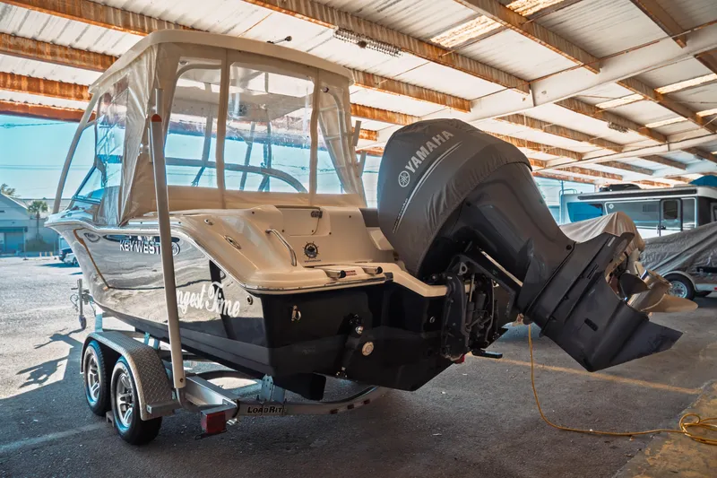 Slide: The Image of 2019 Key West 239 DFS boat with Yamaha engine in covered storage. - 34