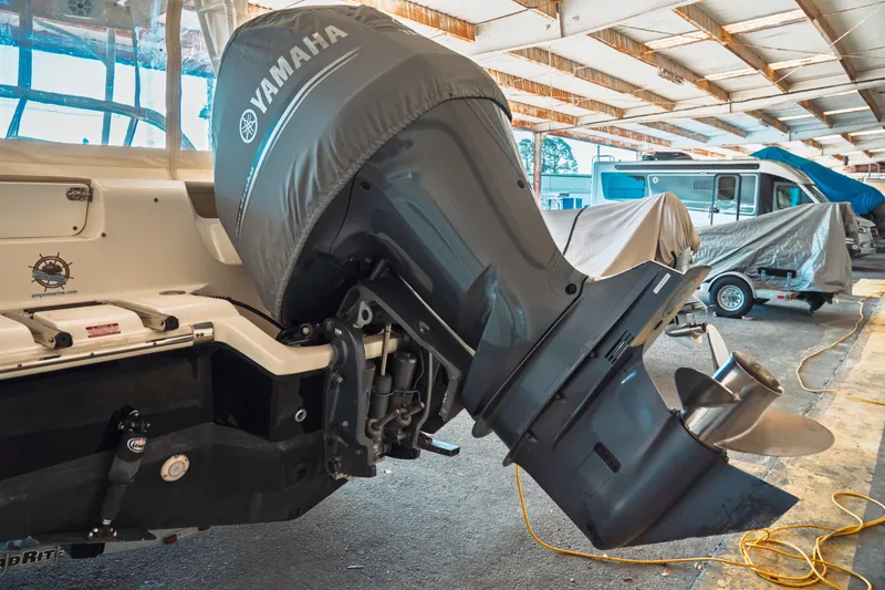 Slide: The Image of 2019 Key West 239 DFS boat with Yamaha outboard motor in covered storage. - 35