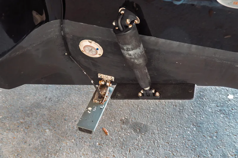 Slide: The Image of 2019 Key West 239 DFS boat transom with trim tab and hydraulic actuator. - 37