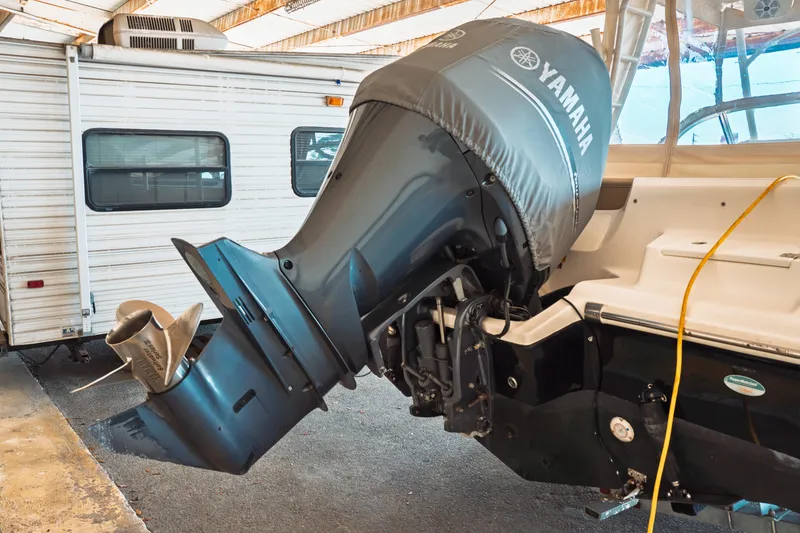 Slide: The Image of 2019 Key West 239 DFS boat with Yamaha outboard motor in storage. - 38