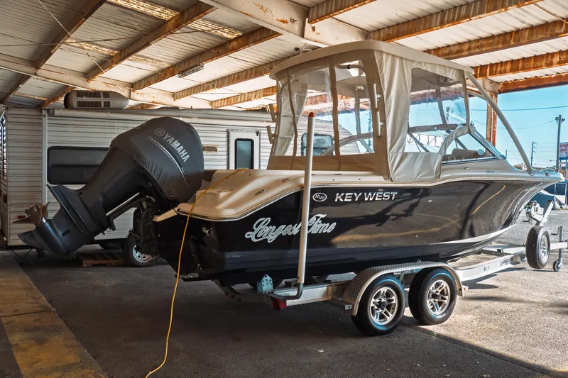 Slide: The Image of 2019 Key West 239 DFS boat with Yamaha engine on trailer under shelter. - 39