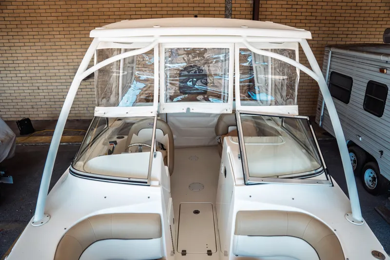Slide: The Image of 2019 Key West 239 DFS boat with dual consoles and protective canopy. - 4
