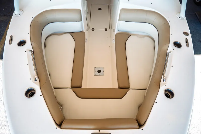 Slide: The Image of 2019 Key West 239 DFS boat interior with beige seating and cup holders. - 5