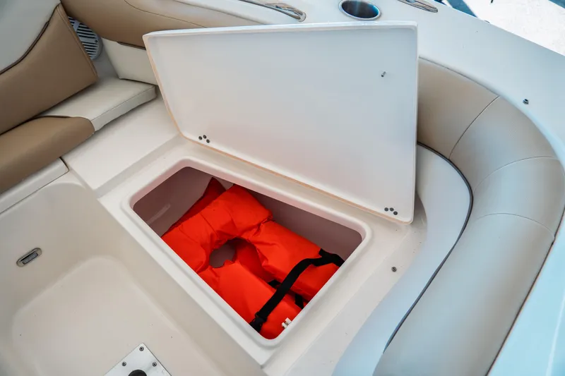 Slide: The Image of Storage compartment with life jacket on 2019 Key West 239 DFS boat. - 7