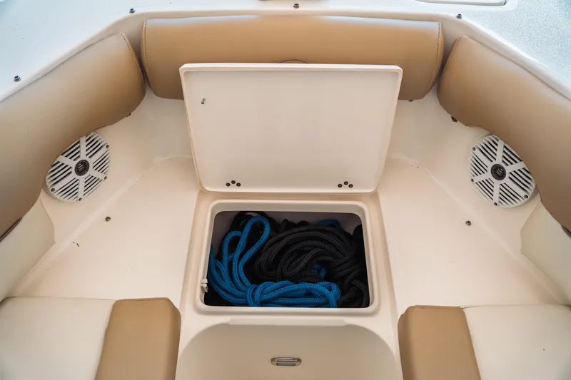 Slide: The Image of 2019 Key West 239 DFS boat storage compartment with ropes and speakers. - 8
