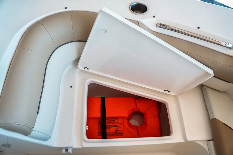 Slide: The Image of Storage compartment with life jacket on 2019 Key West 239 DFS boat. - 9