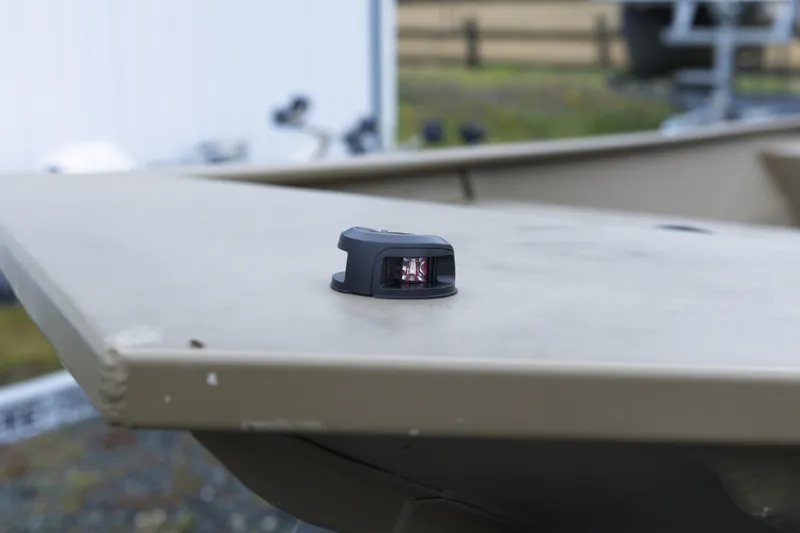 Slide: The Image of 2025 G3 Gator Tough 1652 VBW boat detail with navigation light on deck. - 5