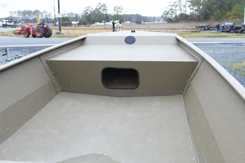 Slide: The Image of 2025 G3 Gator Tough 1652 VBW boat interior, showcasing spacious deck and storage compartment. - 7