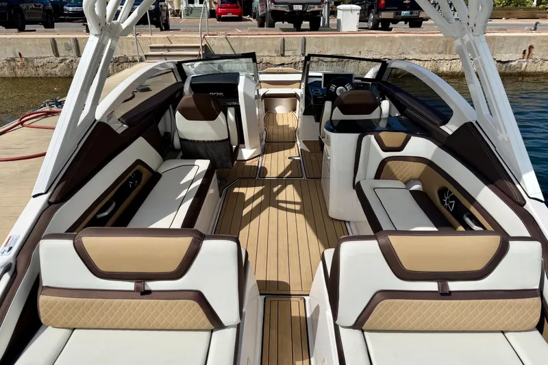 Slide: The Image of 2022 Yamaha Boats 275SD interior with luxurious seating and modern design. - 11
