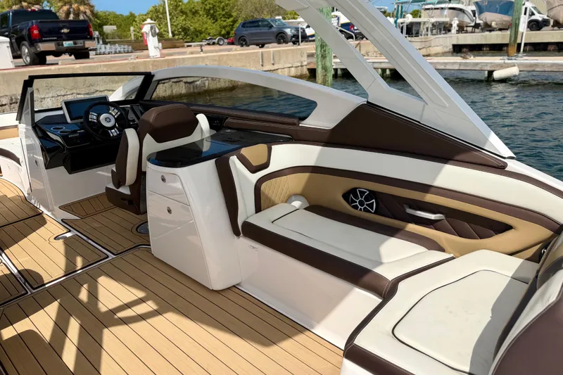 Slide: The Image of 2022 Yamaha Boats 275SD interior with luxurious seating and modern dashboard design. - 27