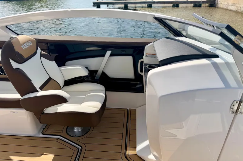 Slide: The Image of 2022 Yamaha Boats 275SD interior with luxurious seating and sleek design. - 30