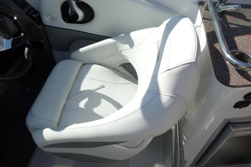 Slide: The Image of White leather seat in 2013 Rinker 296 Captiva Cuddy boat cockpit. - 18