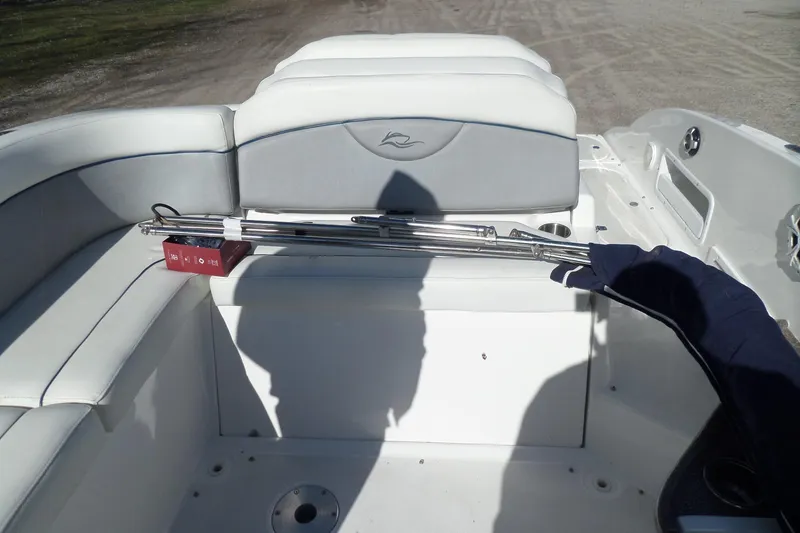 Slide: The Image of 2013 Rinker 296 Captiva Cuddy boat interior with white seating and accessories. - 19
