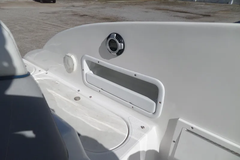 Slide: The Image of 2013 Rinker 296 Captiva Cuddy boat interior detail with storage compartment. - 24