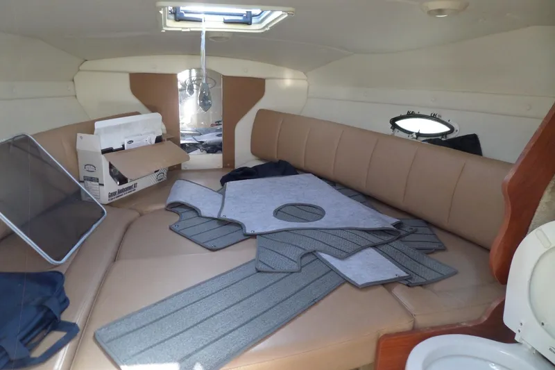 Slide: The Image of 2013 Rinker 296 Captiva Cuddy cabin interior with seating and accessories. - 25