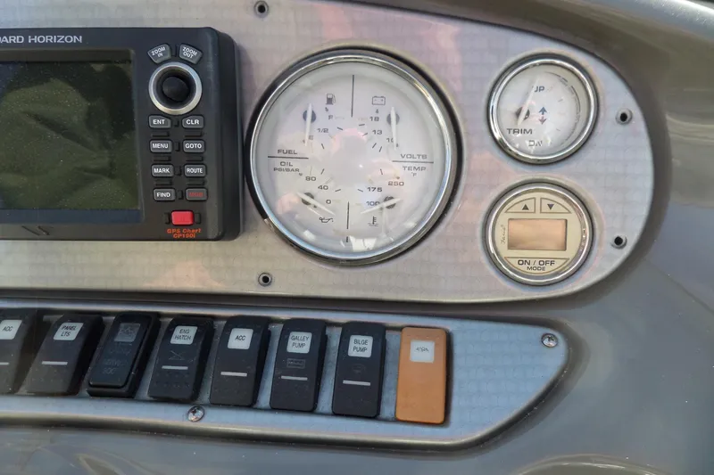 Slide: The Image of Dashboard of a 2013 Rinker 296 Captiva Cuddy with gauges and controls. - 30