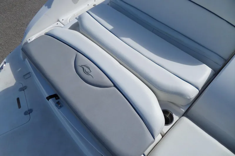 Slide: The Image of 2013 Rinker 296 Captiva Cuddy boat seating with gray and white upholstery. - 35